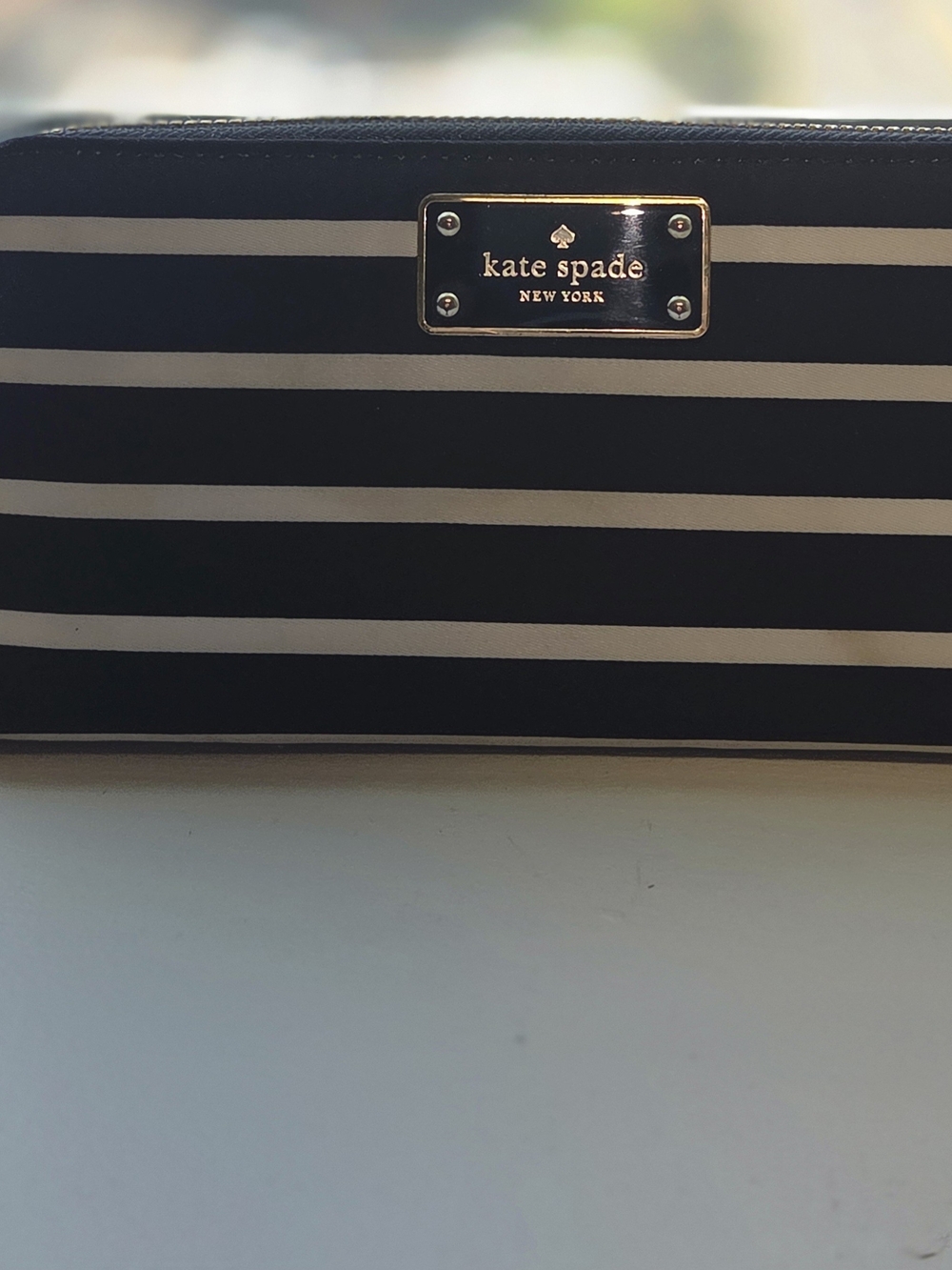 kate spade Black and White Striped Zip Wallet with Gold Plaque